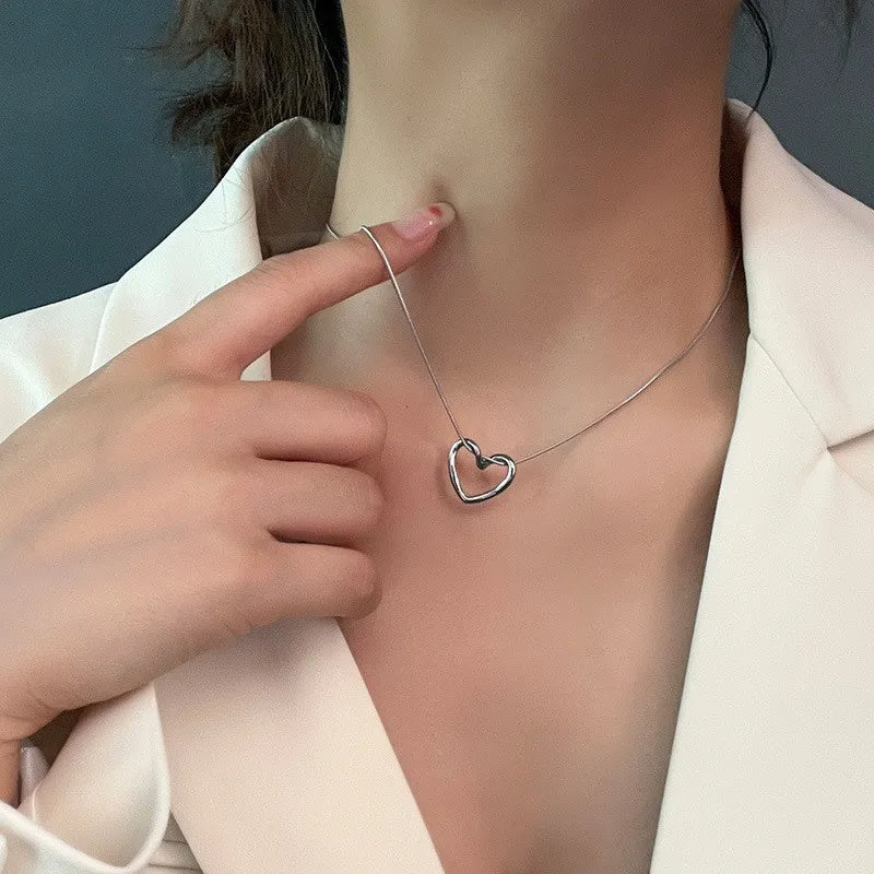 Stainless Steel Hollow Heart Pendant Necklace – Elegant, Trendy Clavicle Chain for Women & Girls. - Trenvo