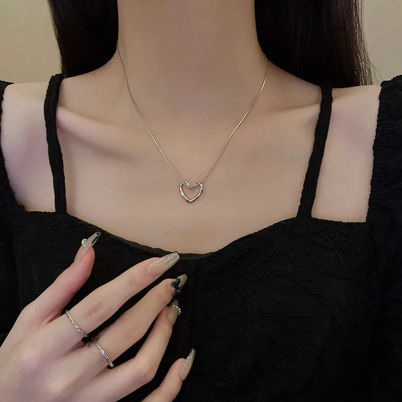 Stainless Steel Hollow Heart Pendant Necklace – Elegant, Trendy Clavicle Chain for Women & Girls. - Trenvo